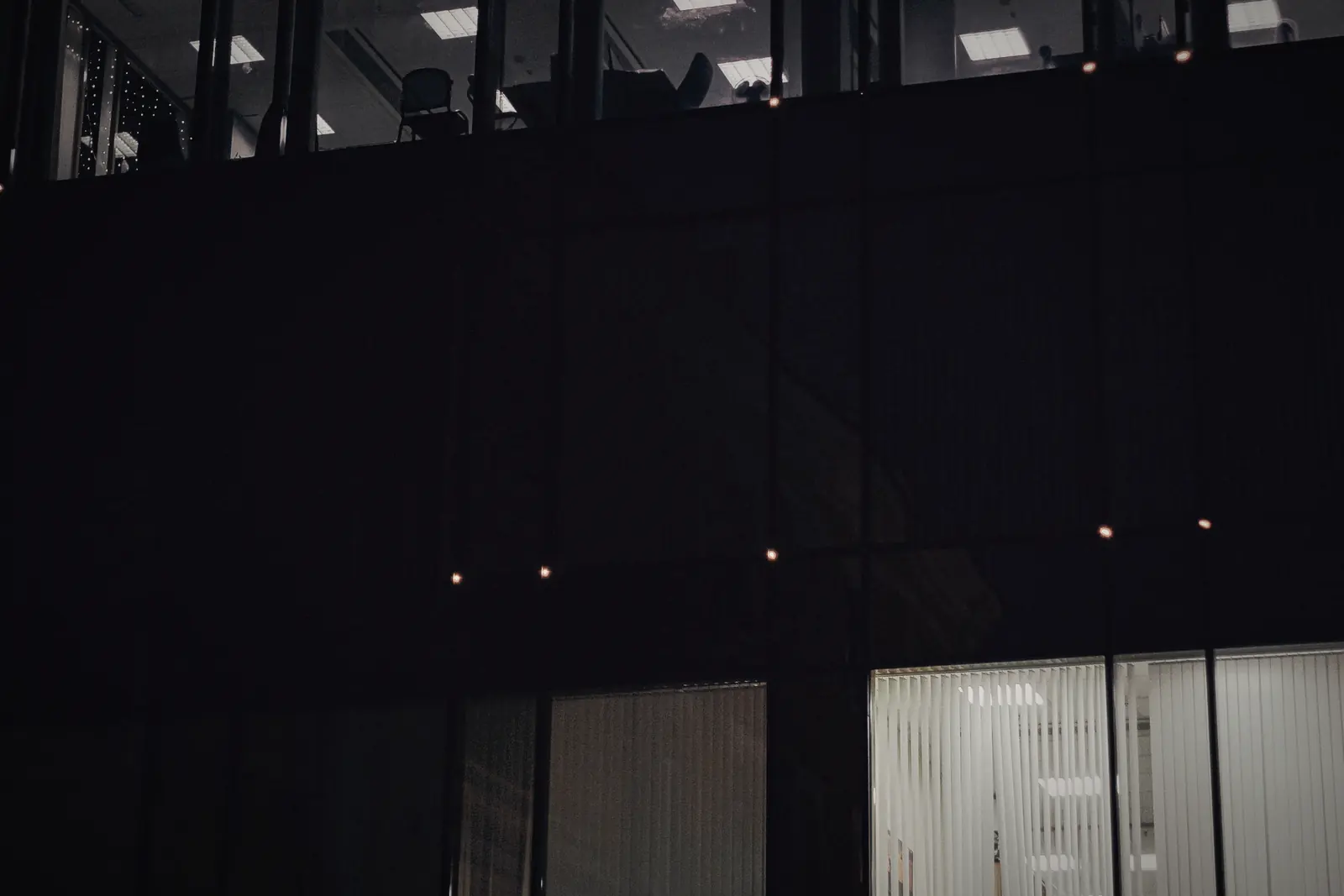 Office windows lit at night